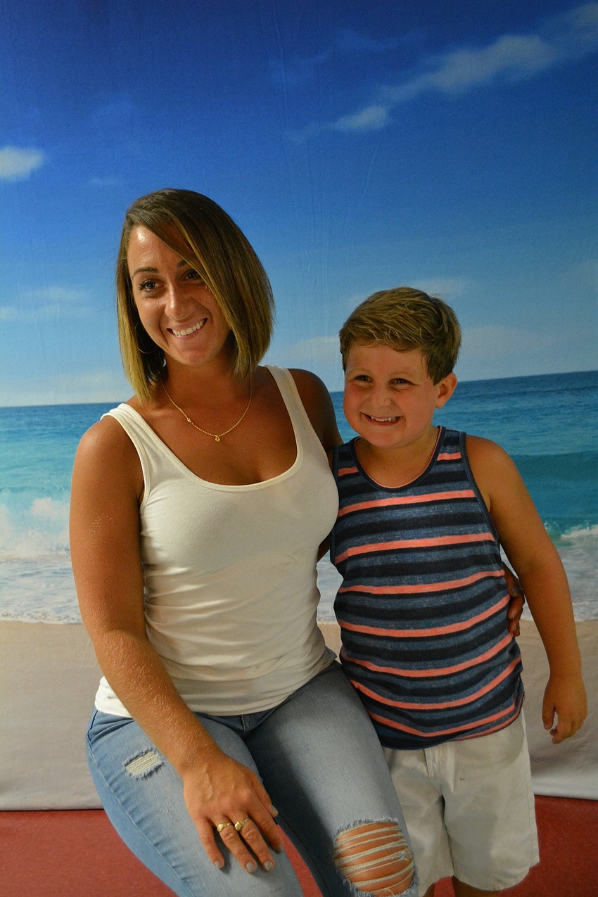 Allison Bower and her son, Jonni Botti, a first grader, pose for a photo.