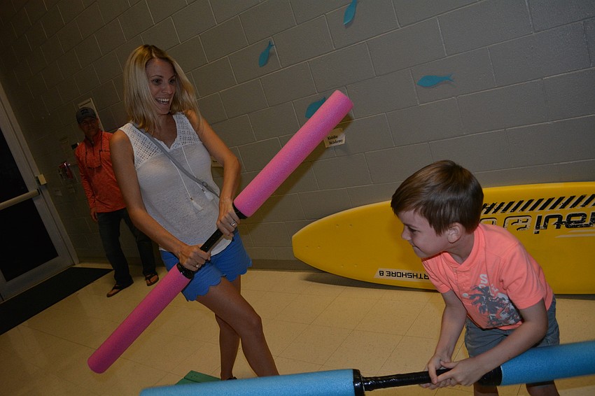 Savannah Francis combats her son, Levi,