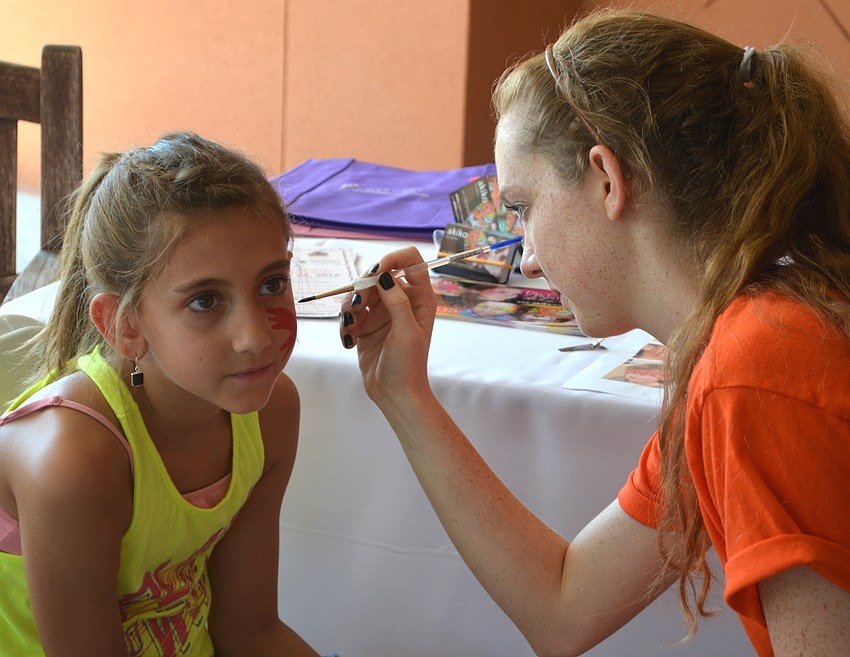 Lakewood Ranch's Alexa Durkin, 8, trusts Rosie McClure to create a perfect design.