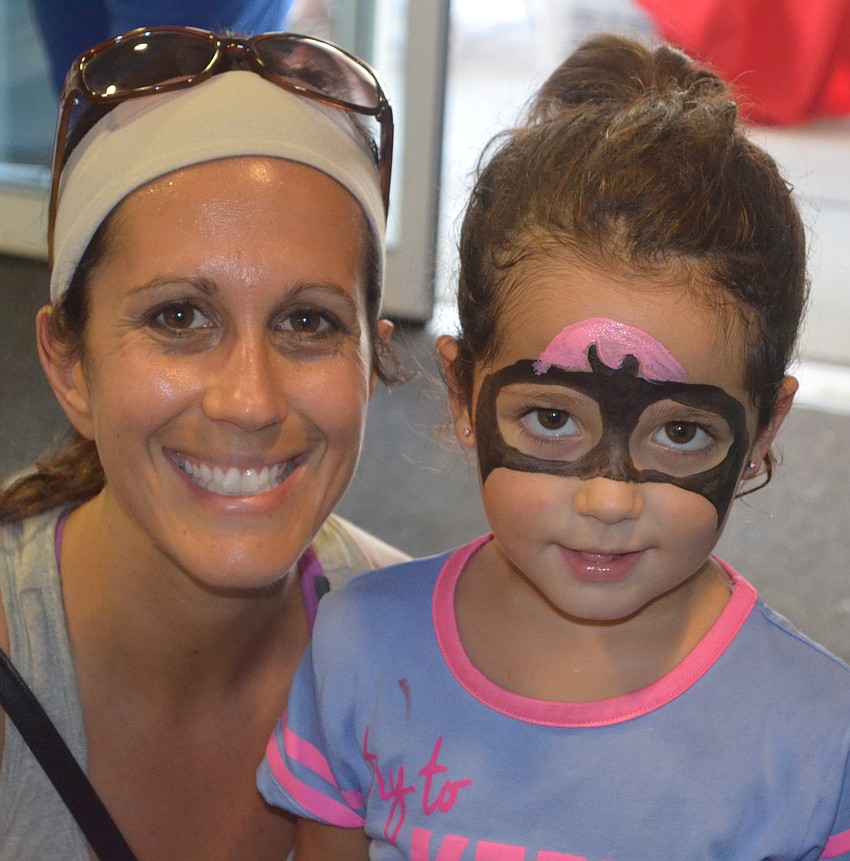 Lakewood Ranch's Amber Petricca and her daughter, Maya, enjoy the face painting booth.