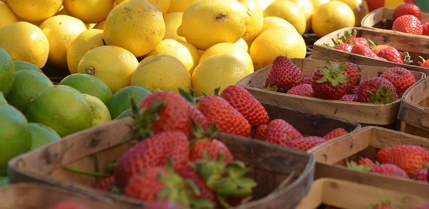 Strawberries, lemons and limes sit under the tent at the farmers market, new to the Health and Wellness Expo this year.