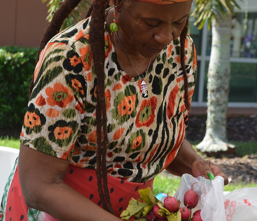 Bradenton's Carrie Dula, with Come Under the Yum Yum Tree, sells fruits and vegetables.