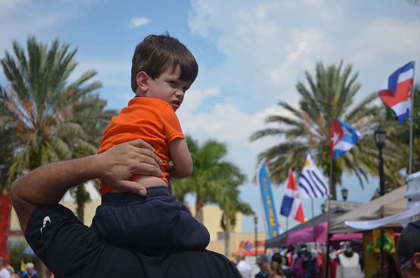 Sarasota's Alejandro Brown, 3, gets a VIP ride from his dad, Victor Torref, as he carries him on his shoulders during the Viva Latino Festival.