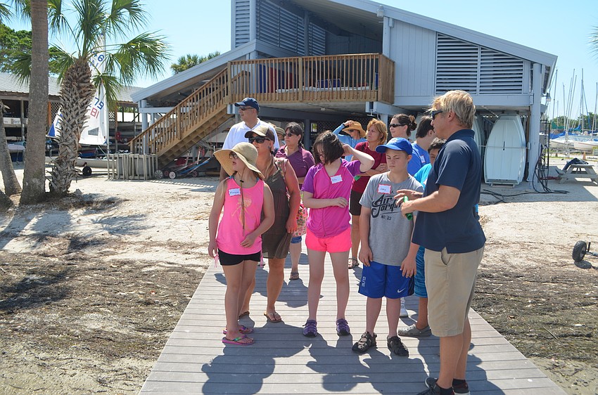 Sarasota Sailing Squadron Director, Craig Bridges, explains the basics of sailing to the group.