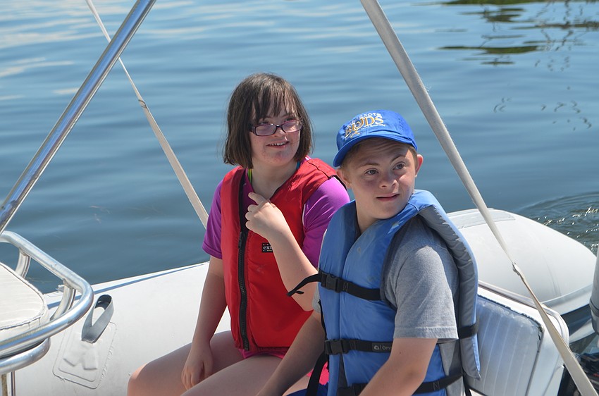 Ella Quaid and Joey Baar, both 15, get ready for a boat ride around the bay during a Manasota BUDS book club gathering on Sept. 24.