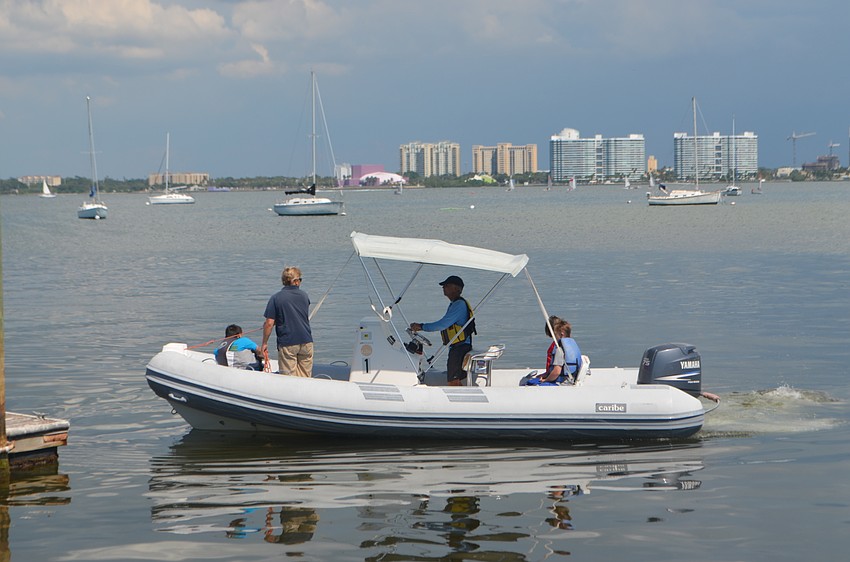 The group took turns going on boat rides to watch Sarasota Sailing Squadron sailors.