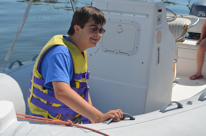 Andrew Feduccia, 13, is all smiles before his boat ride around the bay.