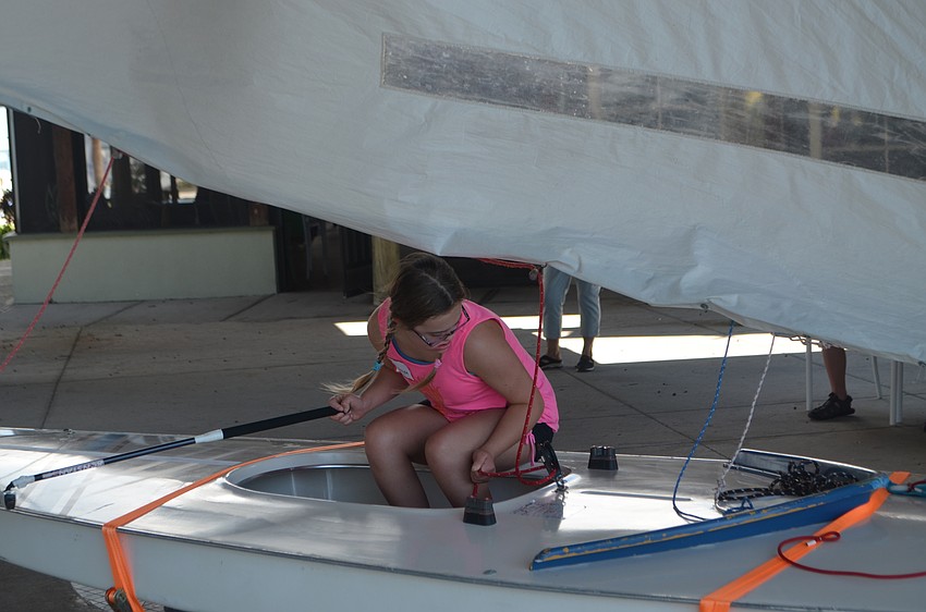 Morgan Summers ducks as the sail shifts. Summers and other members of Manasota BUDS spent an afternoon at the Sailing Squadron on Sept. 24.