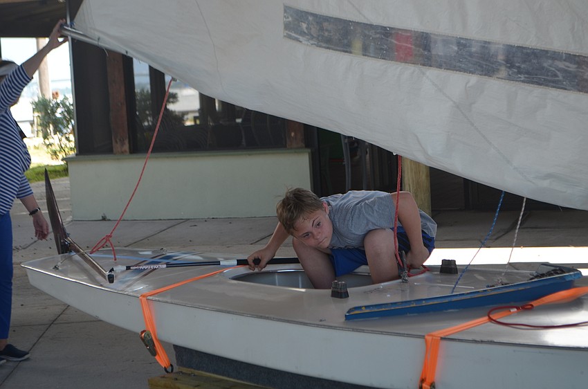 Joey Baar, 15, ducks as the sail shifts. Baar and other Manasota BUDS members learned all about sailing during an outing to the Sarasota Sailing Squadron on Sept. 24.
