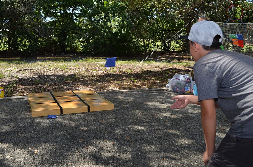 Dominik Mesaros aims for the tic-tac-toe board.