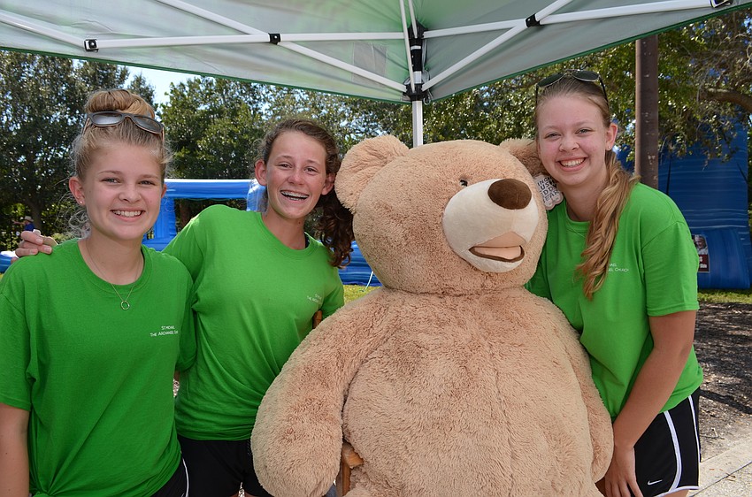 Maggie Kennelly, Sydney Hays and Shannon Kennelly with Barry the bear.