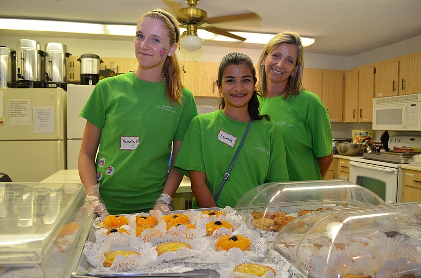 Nathalie Bencie, Leonela Tase and Teresa Bencie sell fresh French baked goods.