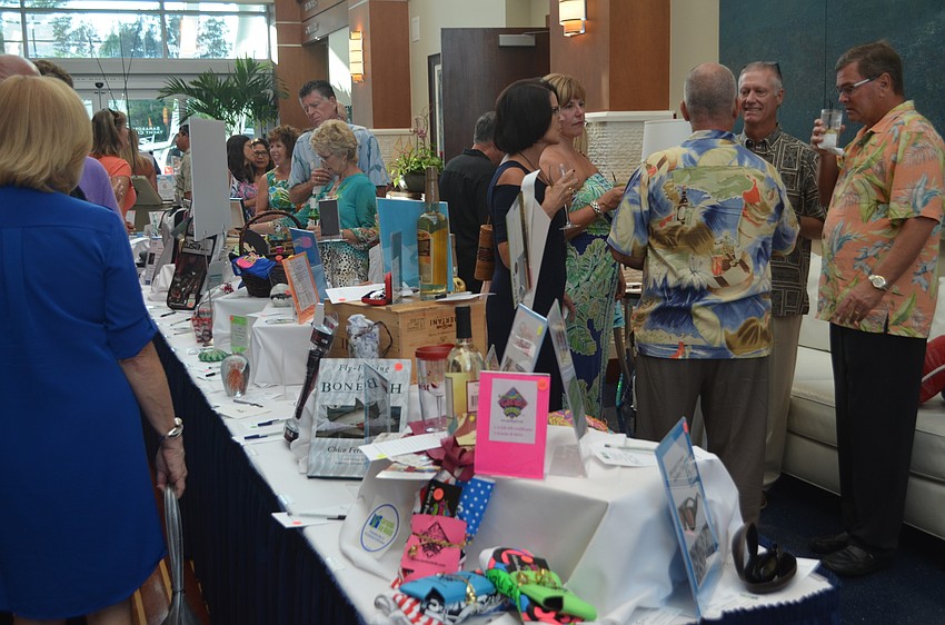 A silent auction was set up in the main foyer of the Sarasota Yacht Club. In a separate room, a Chinese auction was held.