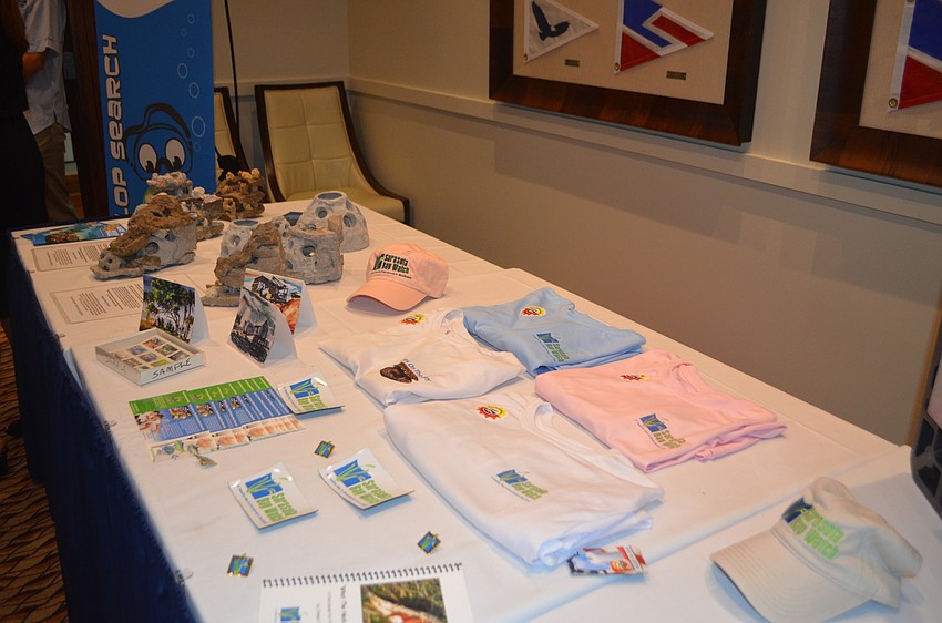 An information table was set up with information about the Sarasota Bay Watch’s efforts as guests signed in at the 6th annual Scallopalooza on Sept. 24.