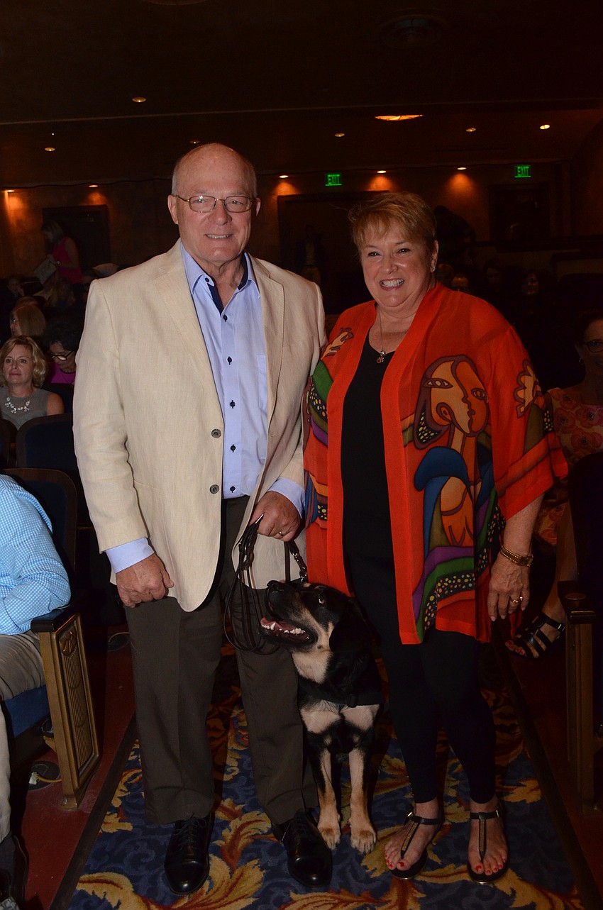 Dennis and Dorthea Quinn with Southeastern Guide Dogs puppy Chef. The couple won the 2016 Superheroes on the Street Social Media award for taking the most selfies with the dog sculptures around Sarasota and Bradenton.