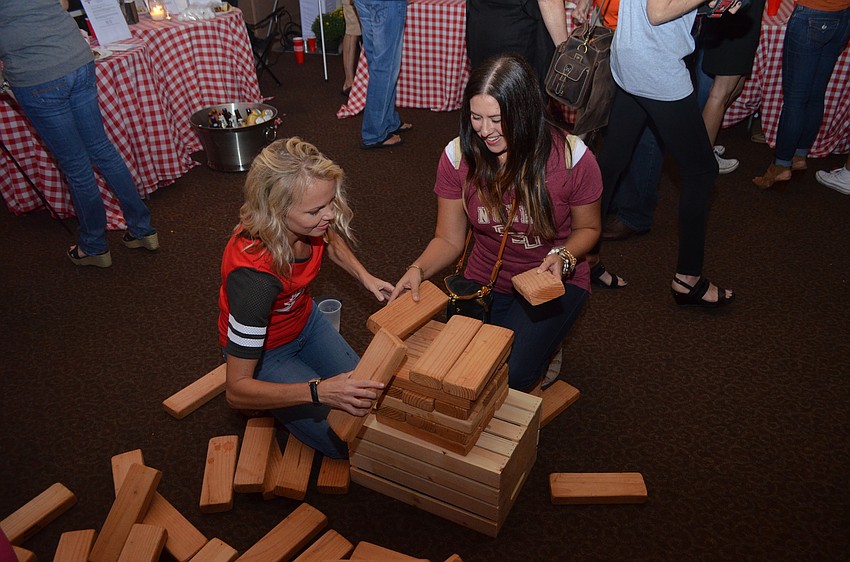 Autumn McConnell and Nicole Dolan play jenga.