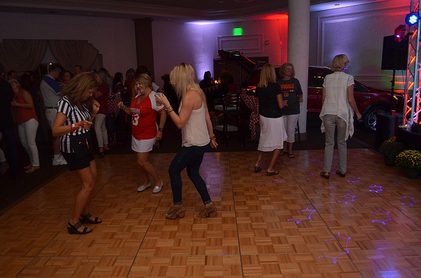 Attendees hit the dance floor to bust a move.