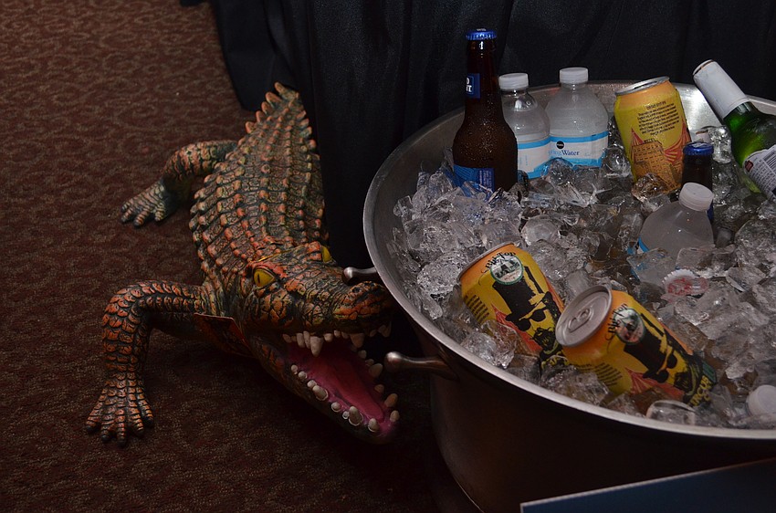 A plastic gator guards the beverage bucket under the Florida Gators tailgate tent.
