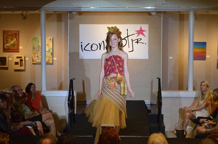 Alexia Nelson, 12, hits the runway in “Autumn Feel,” which she made from fabric, gauze and plastic leaves.