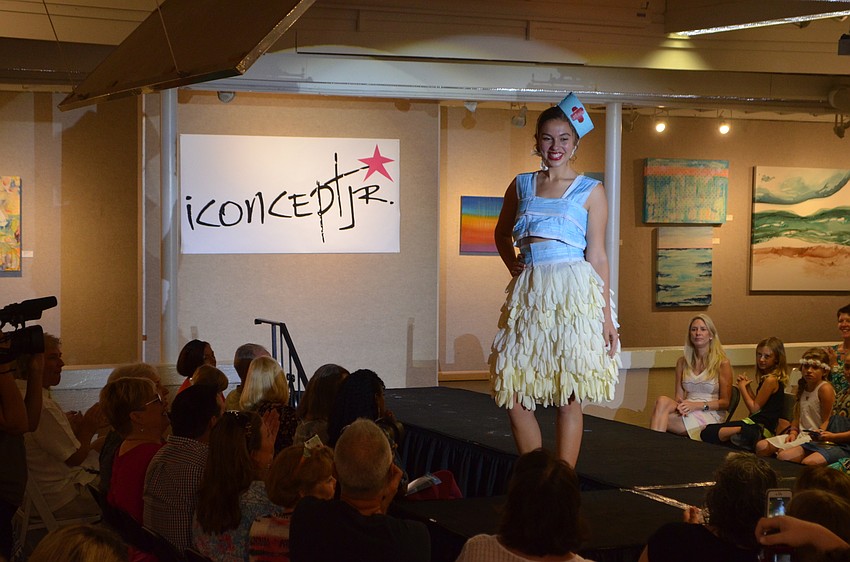 Meredith Housh sports designer Allison Housh’s “Fashion Emergency” piece, which was made using latex gloves and surgical masks. The designer decided to go with a healthcare theme as an homage to her dream of becoming a doctor in the Peace Corps.