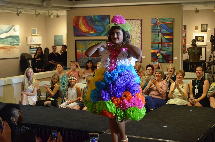 Elizabeth Blitz, 9, poses for the crowd as she models her creation 