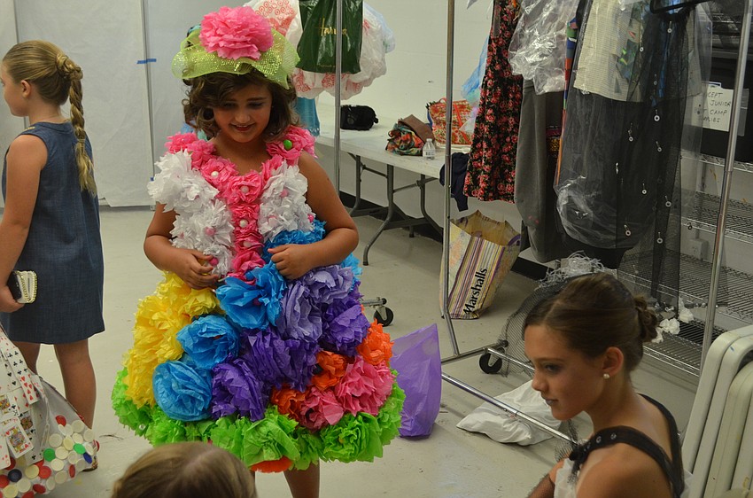 iconcept jr. designer/model Elizabeth Blitz, 9, hangs out backstage with fellow designer/model Lauren Van Nostrand, 11.