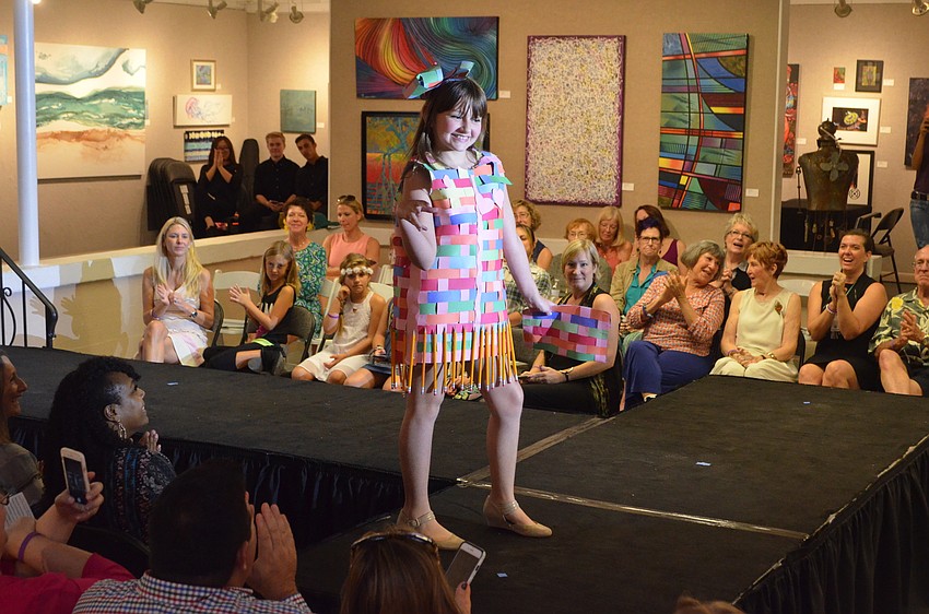 Sienna Hanson, 9, strikes a pose as she models her ensemble, “Dreamweaver.” Hanson used paper, pencils and hot glue to create her back-to-school-themed garment.