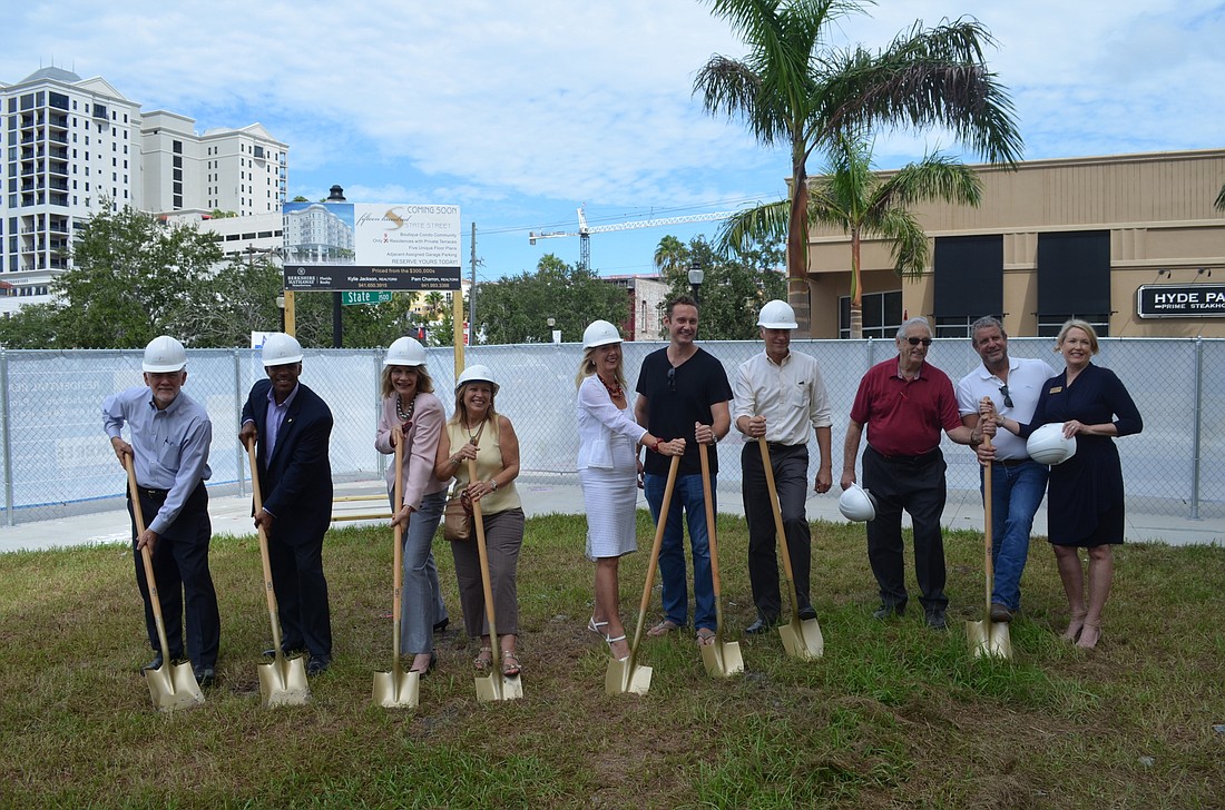Joe R. Hembree, Deputy City Manager Marlon Brown, city commissioners Suzanne Atwell and Liz Alpert, Elita Kane, Janis Krums, Chris Gallagher, Mark Kauffman, Tom Jackson and Kelley Lavin pose at today's groundbreaking.