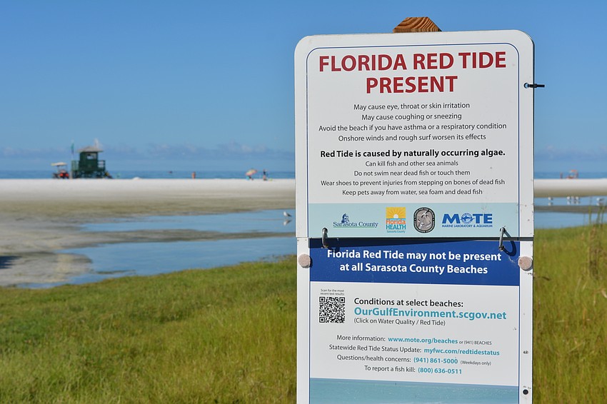 County officials are warning beachgoers of the presence of red tide on Siesta Key.