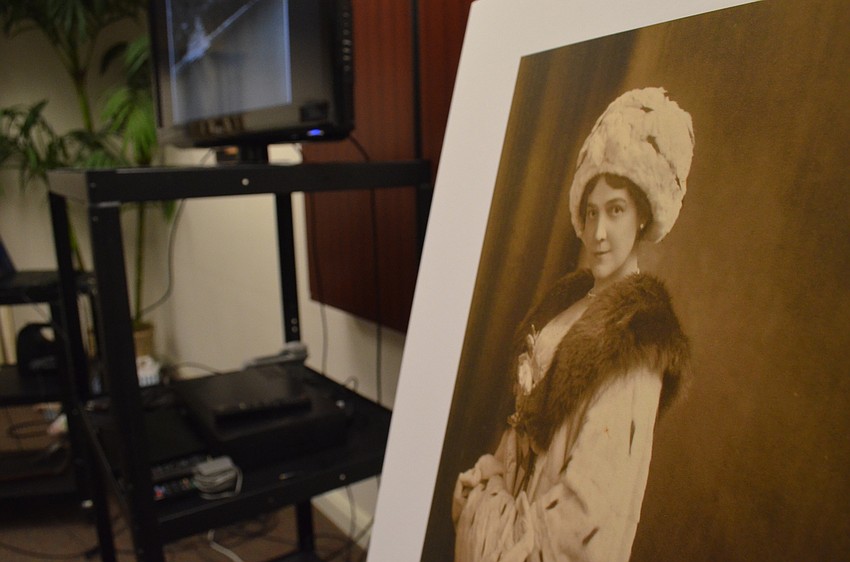 A print of Mable Ringling helps Ron McCarty explain her humble elegance.