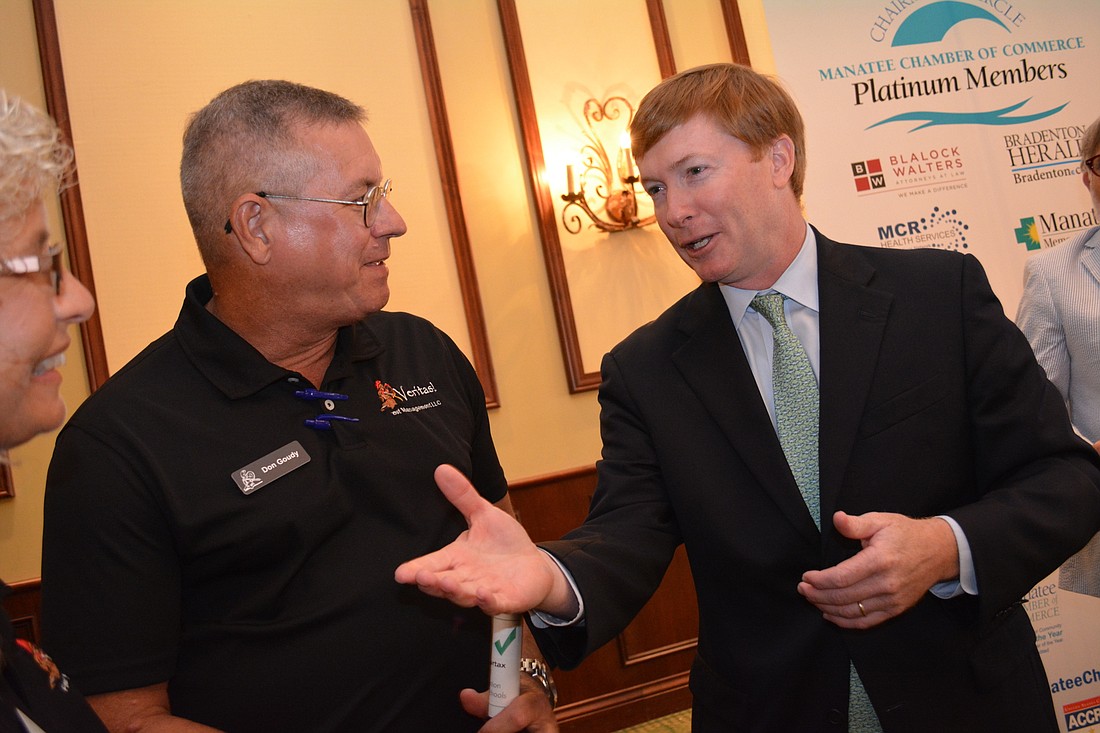 Florida Commissioner of Agriculture Adam Putnam, right,  speaks with Don Goudy, of Veritas! Pest Management, who attended a presentation by Putnam Sept. 27, at the Polo Grill and Bar.