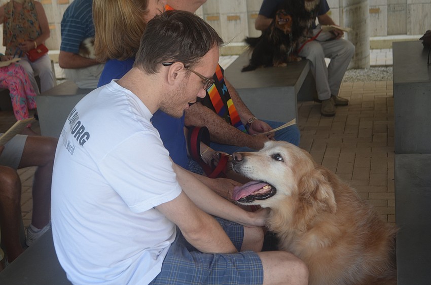 Angus, a golden retriever, seeks attention from Charlie Farrell during St. Boniface Episcopal Church’s annual animal blessing on Oct. 1.