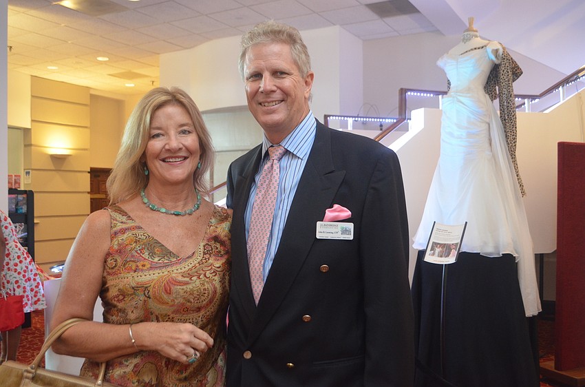 Event sponsor John Leeming of J.L. Brainbridge and Sarasota Ballet Outreach Coordinator Sara Sardelli greet the audience at the second annual Tea & Tutus event. 
Laura and John Leeming