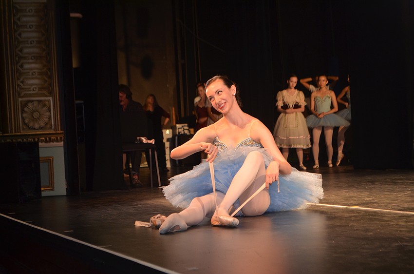 Madeleine Purcell shows the audience the proper way to put on ballet shoes.