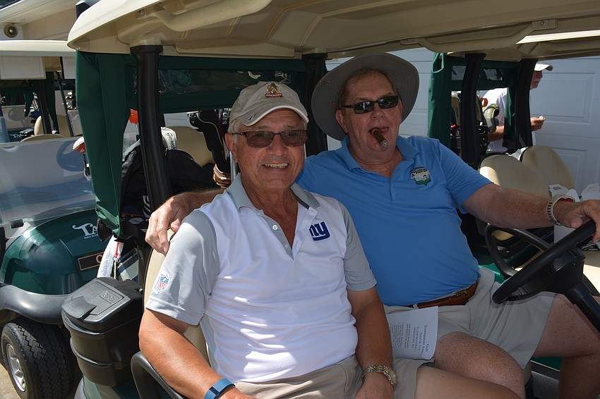 Bruce Gilleylen and Eddie Codelia of University Park get ready to roll on the course to start the tournament.