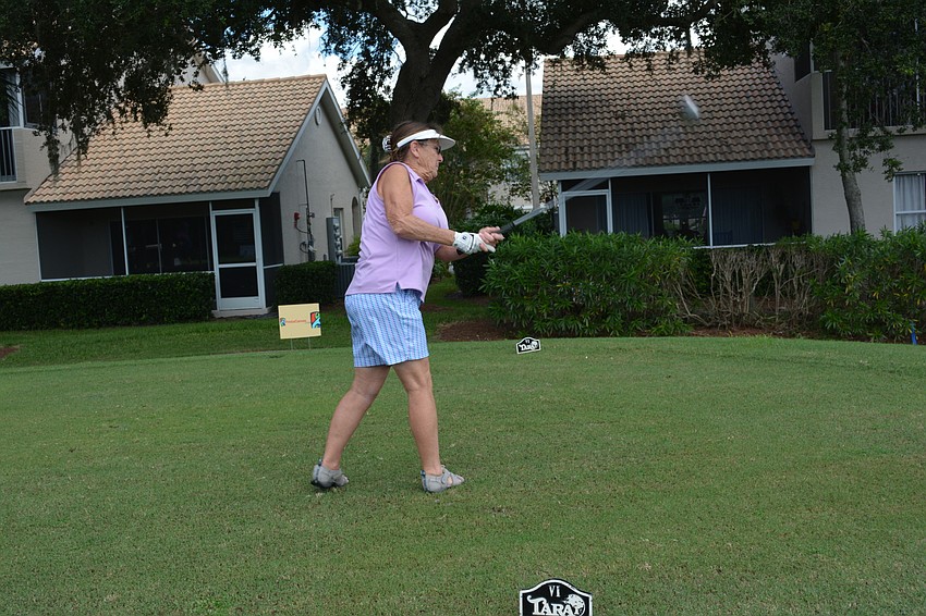 Lakeland's Debbie May drives the ball on No. 4.