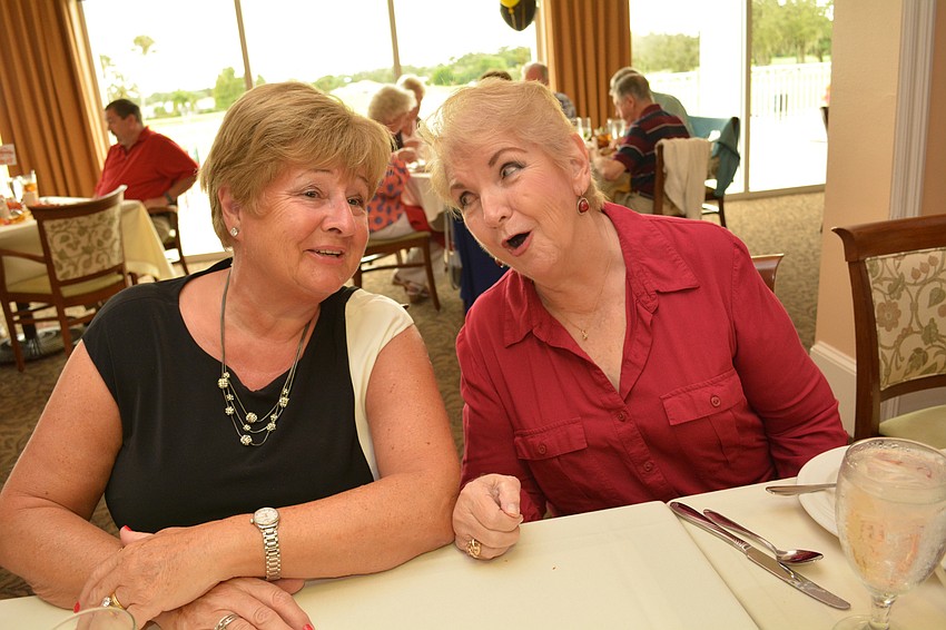 Elaine Thow smiles as her friend Jan Hollymeyer sings to her in German.