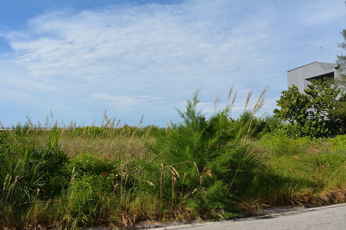 Sarasota County is considering the purchase of two beachfront lots on Siesta Key.
