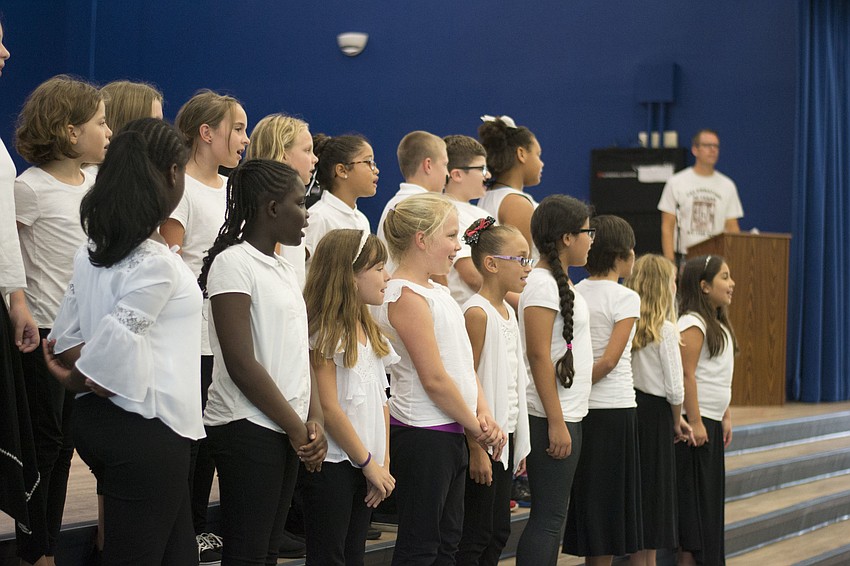 Members of the Bay Haven chorus perform the new school alma mater.