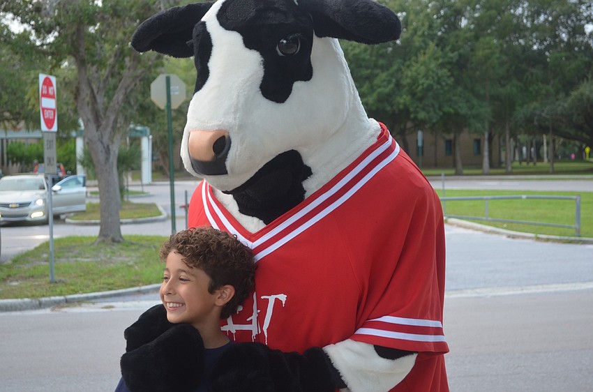 Creekwood's Daniel Kaiser, 9, is excited to see the Chick-fil-A cow after participating in National Walk to School Day.