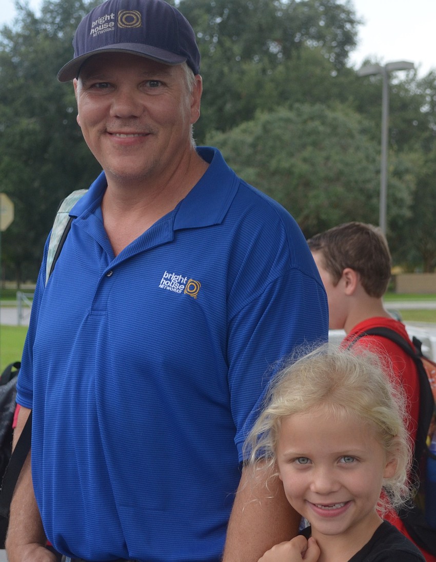Sarasota's Brien Motherway with his 6-year-old daughter,  Caitlin, arrive at school.