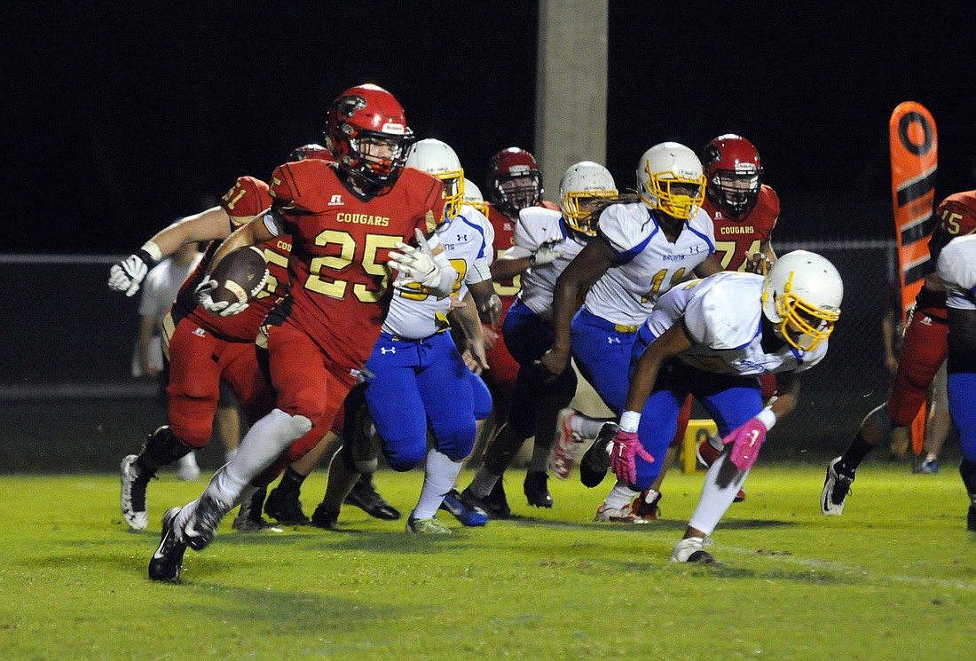 Cardinal Mooney senior Vinny Conetta leads his team against Southeast.