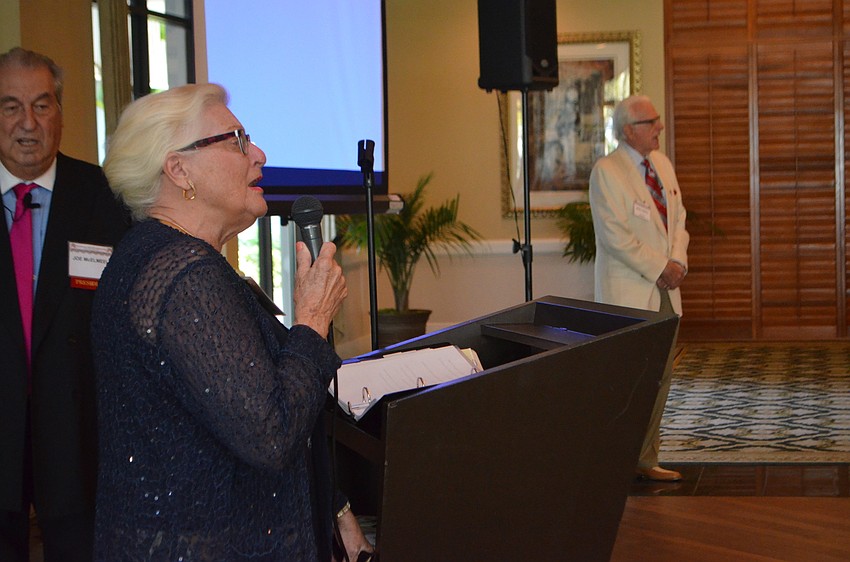 Mary Ellen Criste led the group in singing “God Bless America.”