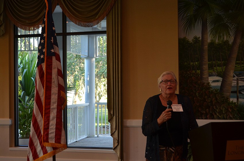 Mary Ellen Criste led the group in singing “God Bless America.”