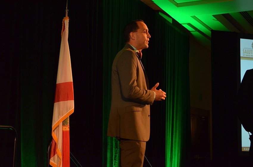 Greater Sarasota Chamber of Commerce President and CEO Kevin Cooper addresses the crowd in his first appearance in his new role.