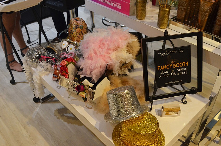 Attendees got to choose from an array of hats, boas and other accessories and props to hit the photo booth with.