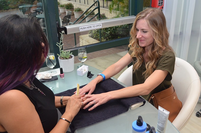Melissa Beachy gets her nails done by Lisa Moody.