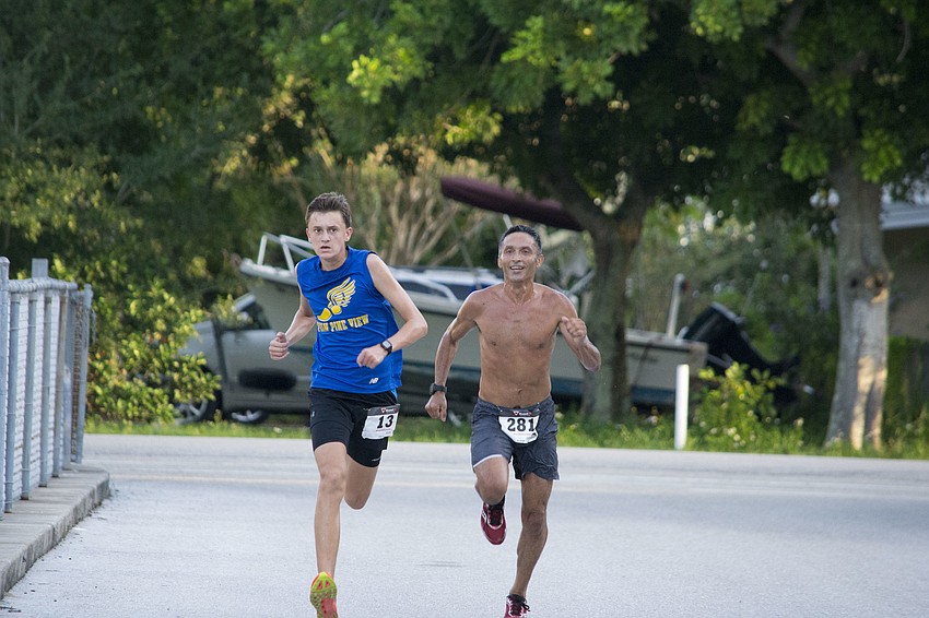 Connor Wozniak and Hector Guzman approach the final stretch of the race.