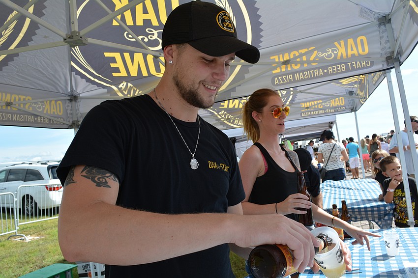 James Haag serves four varieties of IPAs and wheat ales on behalf of Oak and Stone restaurant.