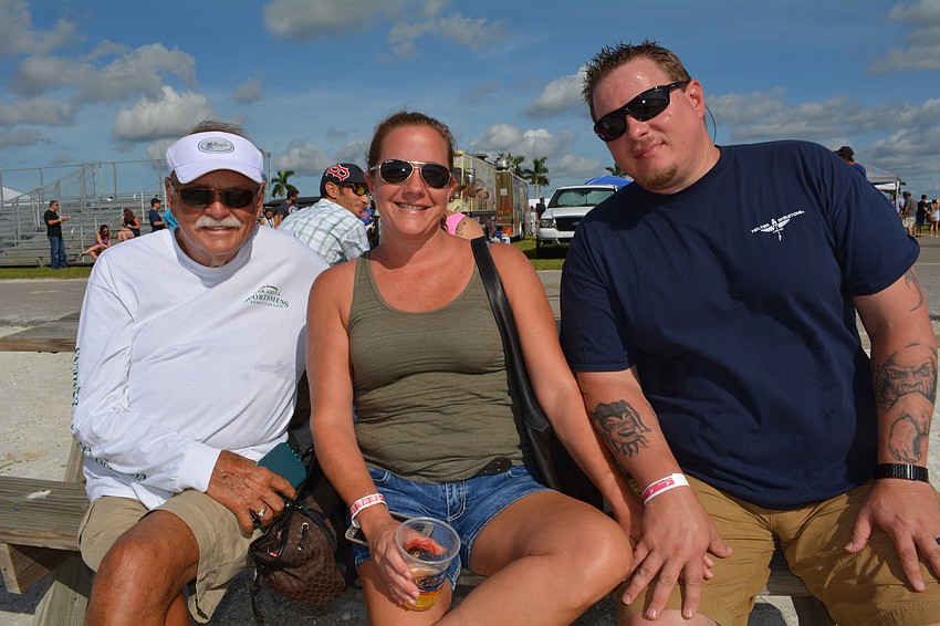 Bob Davidson, of Sarasota, joins his granddaughter, Kerry Fort, and her husband, Shaun Fort, of Parrish.